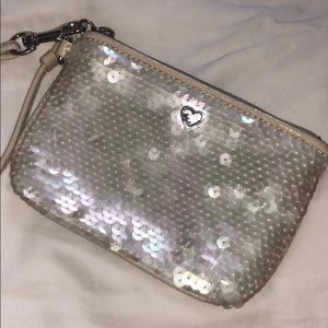 white sequined COACH wristlet